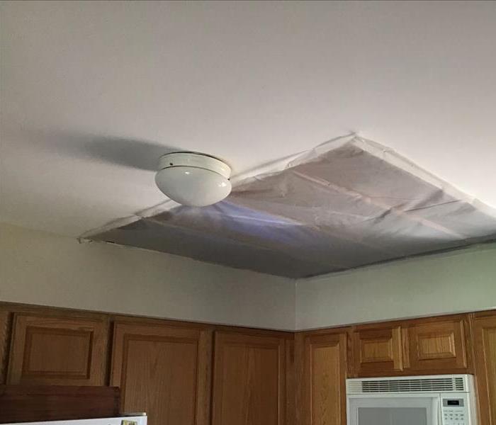 Kitchen ceiling after being professionally cleaned and dried after a bad storm