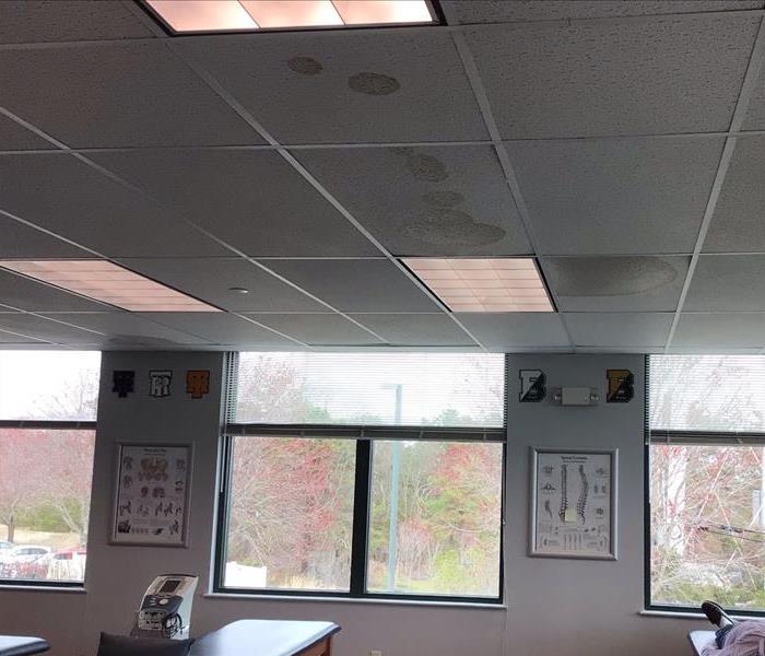 Commercial office building with water damage on the ceiling tiles