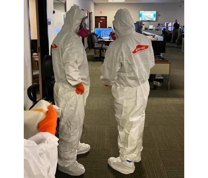 SERVPRO of Toms River in hazmat suits disinfecting Ocean County Sheriff Communications Center