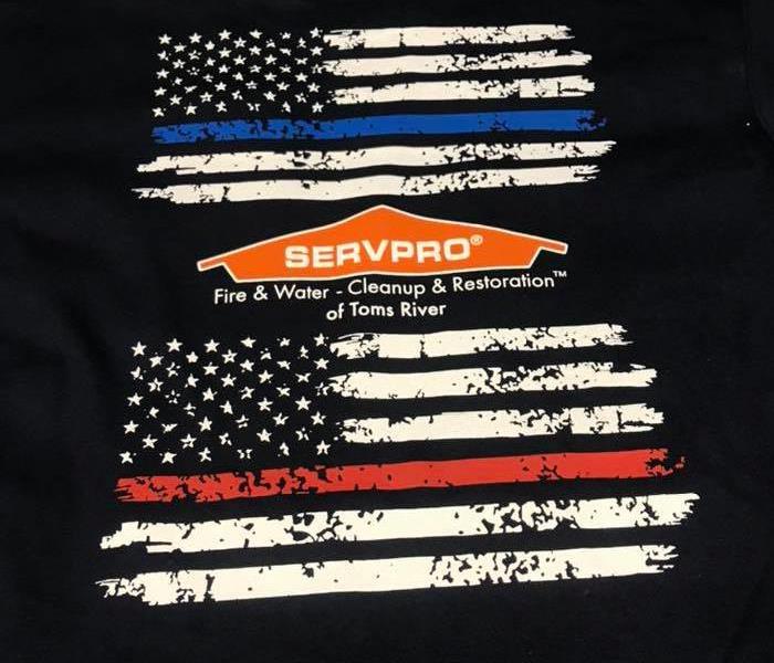 Image shows the American Flags and SERVPRO Fire & Water Cleanup & Restoration of Toms River